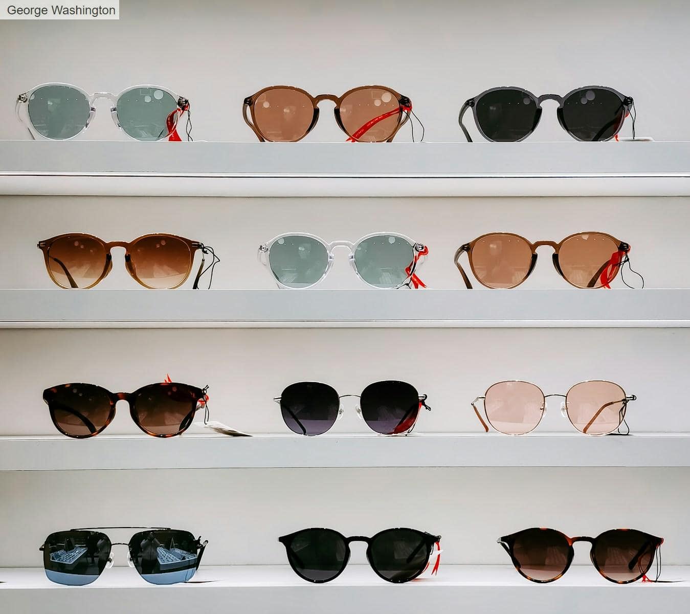 black framed sunglasses on white surface