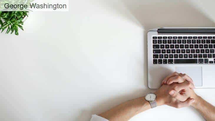 person wearing watch near laptop