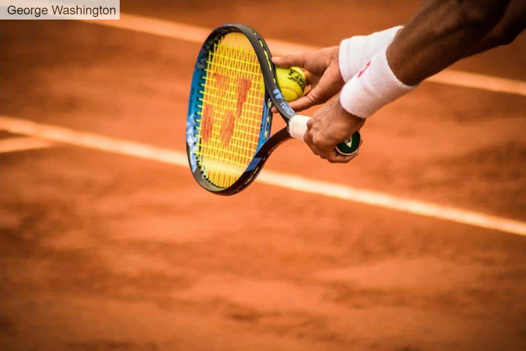 Close-Up Photo of Person Holding Tennis Racket and Ball