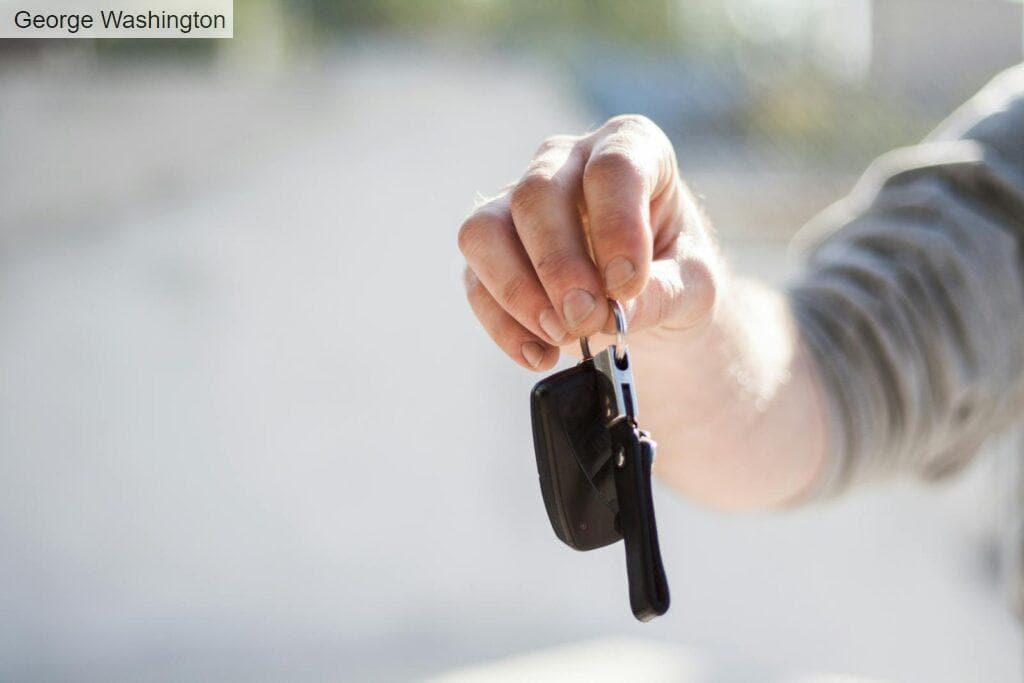Person in Grey Shirt Handing Keys